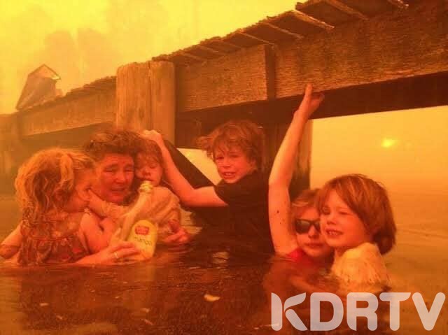 A family wait to be evacuated 