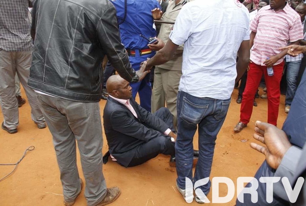 Kuria was forced to sit on the ground