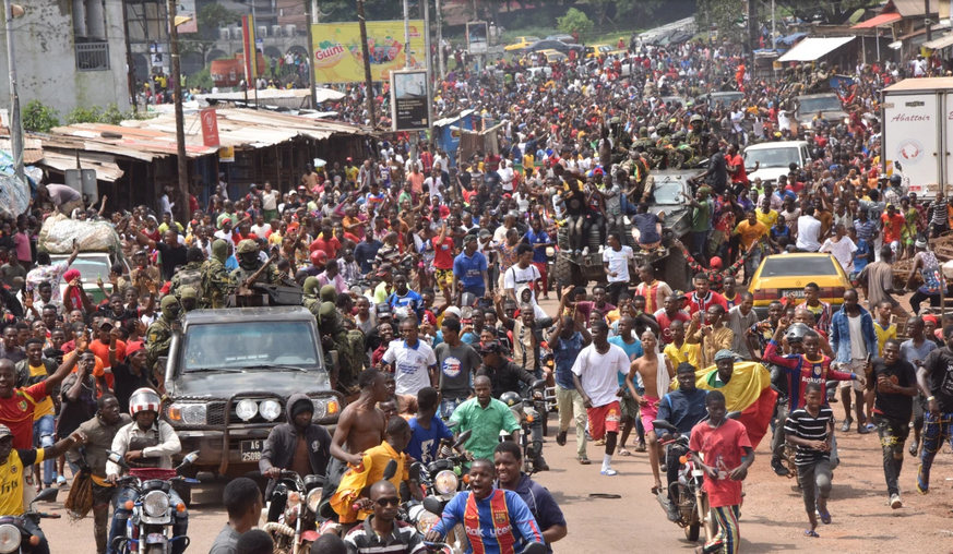 Guineans flood the streets to celebrate the coup with Members of Guinea armed Forces