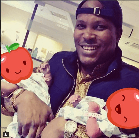Jomo Gecaga holding his baby 1 Jomo Gecaga holding his baby 1